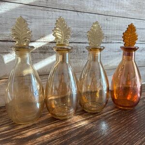 Set of 4 vintage Aurora carnival glass moon water bottles with leaf stoppers